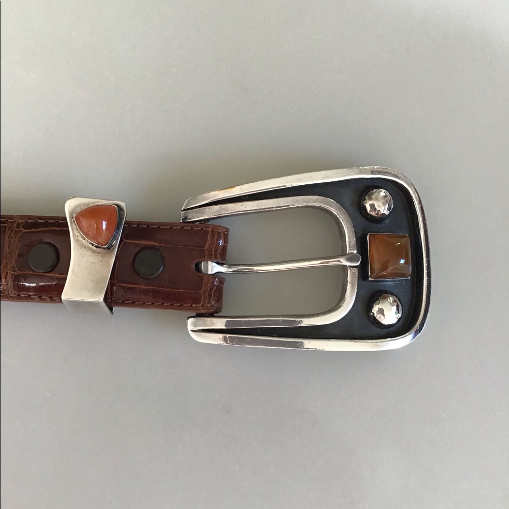 Sterling Silver buckle with alligator belt.